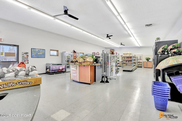 garage with visible vents and a ceiling fan