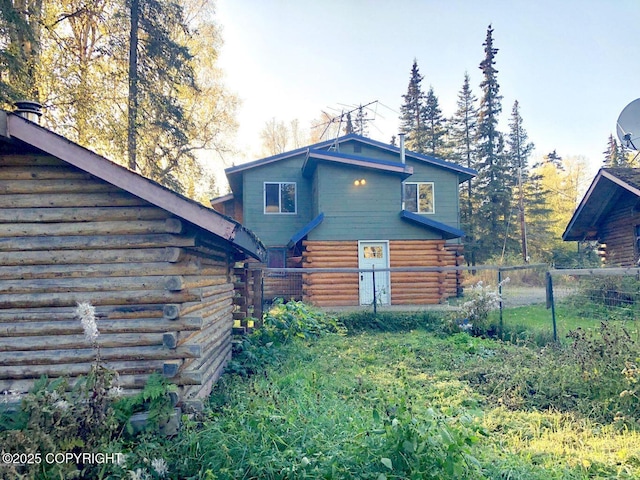52899 Kingery Rd, Nikiski/North Kenai, AK 99611 - back of property featuring log siding and fence