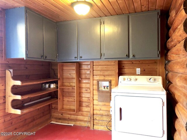 52899 Kingery Rd, Nikiski/North Kenai, AK 99611 - washroom featuring cabinet space, wooden walls, washer / dryer, and wood ceiling
