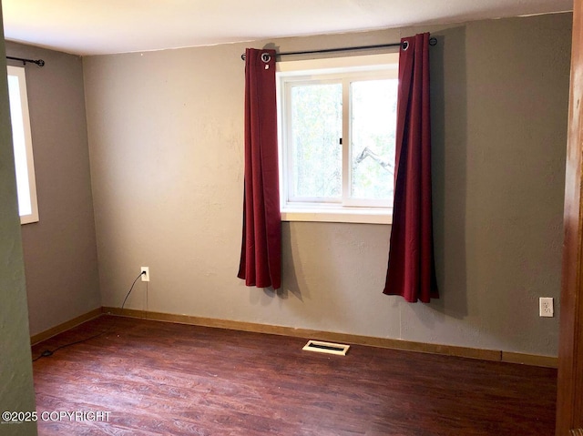 52899 Kingery Rd, Nikiski/North Kenai, AK 99611 - spare room with wood finished floors, baseboards, and visible vents