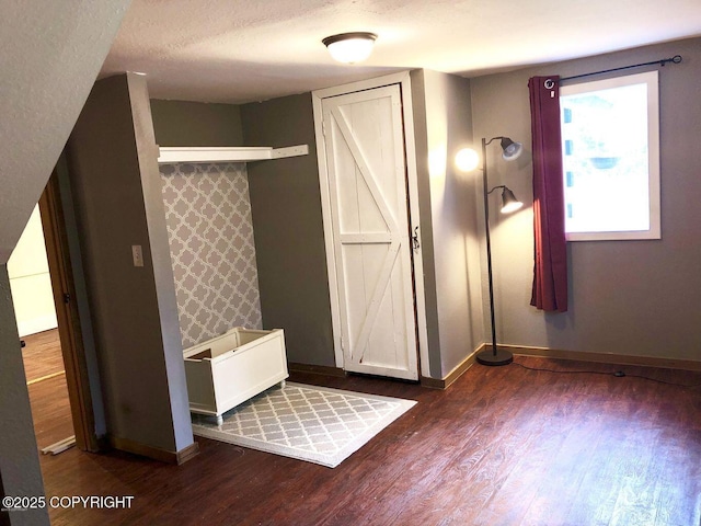 52899 Kingery Rd, Nikiski/North Kenai, AK 99611 - mudroom featuring a textured ceiling, wood finished floors, and baseboards
