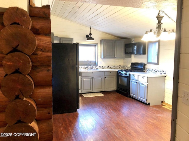 52899 Kingery Rd, Nikiski/North Kenai, AK 99611 - kitchen with dark wood-style flooring, light countertops, black appliances, gray cabinets, and lofted ceiling