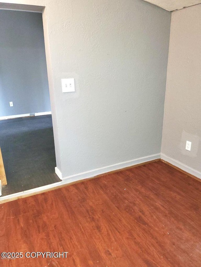 52899 Kingery Rd, Nikiski/North Kenai, AK 99611 - spare room featuring baseboards and wood finished floors