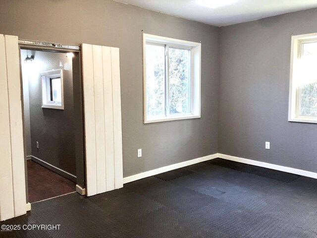 52899 Kingery Rd, Nikiski/North Kenai, AK 99611 - spare room featuring baseboards and carpet flooring