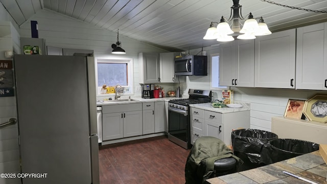 52899 Kingery Rd, Nikiski/North Kenai, AK 99611 - kitchen with dark wood-type flooring, a sink, lofted ceiling, and stainless steel appliances