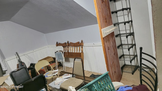 52899 Kingery Rd, Nikiski/North Kenai, AK 99611 - interior space featuring a wainscoted wall and lofted ceiling