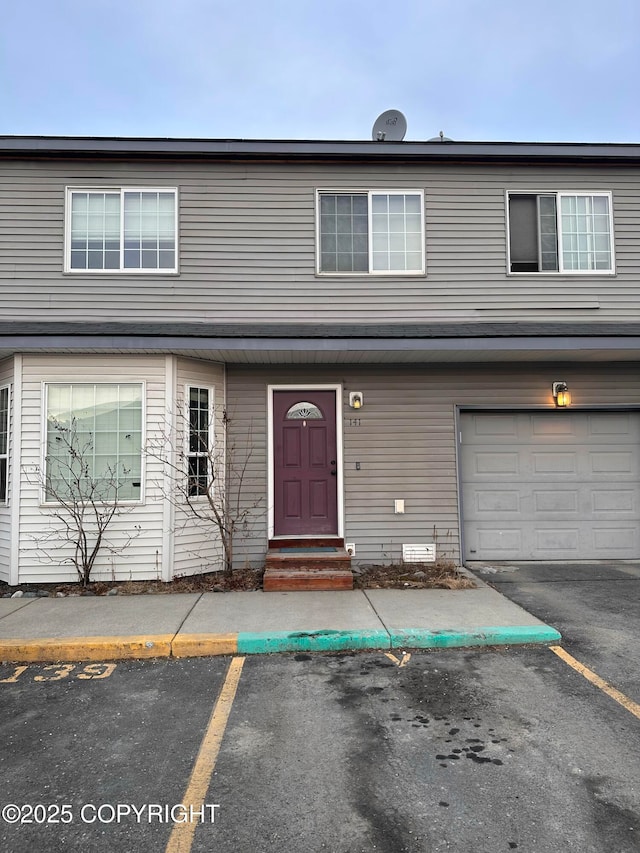 townhome / multi-family property with uncovered parking