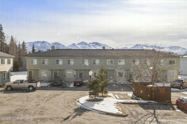 back of house with a mountain view