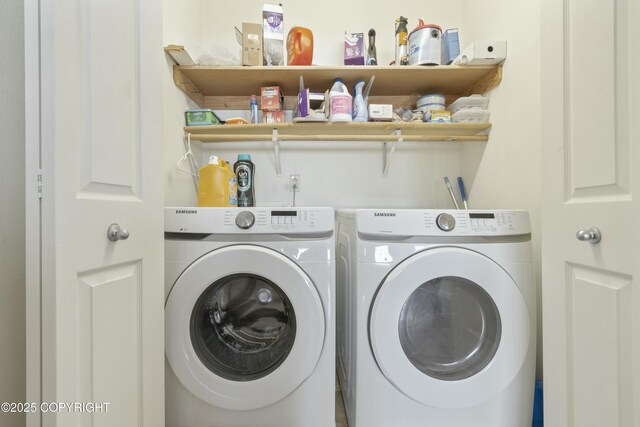 laundry room with independent washer and dryer and laundry area
