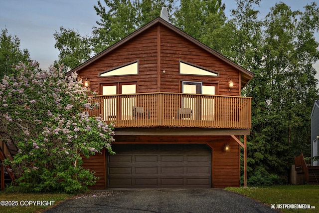 19111 Sarichef Loop, Eagle River, AK 99577 - view of front of house with driveway, a garage, and a balcony