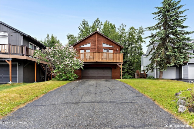 19111 Sarichef Loop, Eagle River, AK 99577 - chalet / cabin with a front yard, an attached garage, stairway, driveway, and a deck