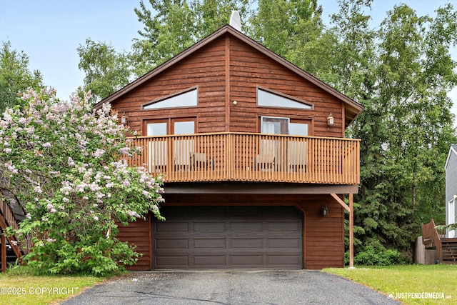 19111 Sarichef Loop, Eagle River, AK 99577 - view of front of property with an attached garage, driveway, and a balcony