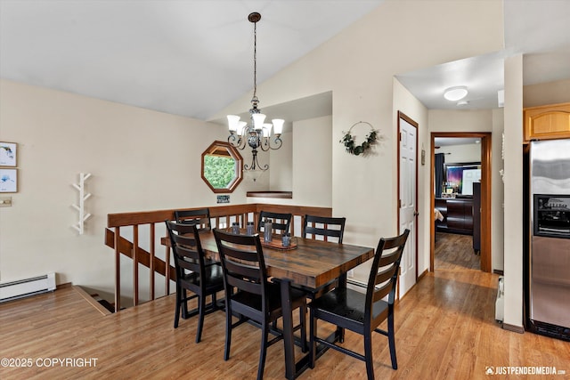 19111 Sarichef Loop, Eagle River, AK 99577 - dining area with light wood-type flooring, vaulted ceiling, a chandelier, and baseboard heating