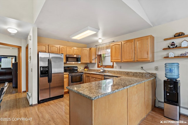 19111 Sarichef Loop, Eagle River, AK 99577 - kitchen featuring stainless steel appliances, a peninsula, a baseboard radiator, light stone countertops, and light wood-type flooring