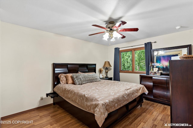 19111 Sarichef Loop, Eagle River, AK 99577 - bedroom featuring wood finished floors and ceiling fan