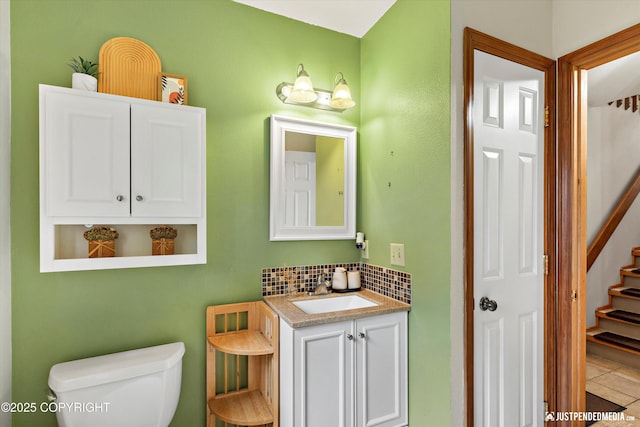 19111 Sarichef Loop, Eagle River, AK 99577 - bathroom with vanity, tasteful backsplash, and tile patterned floors