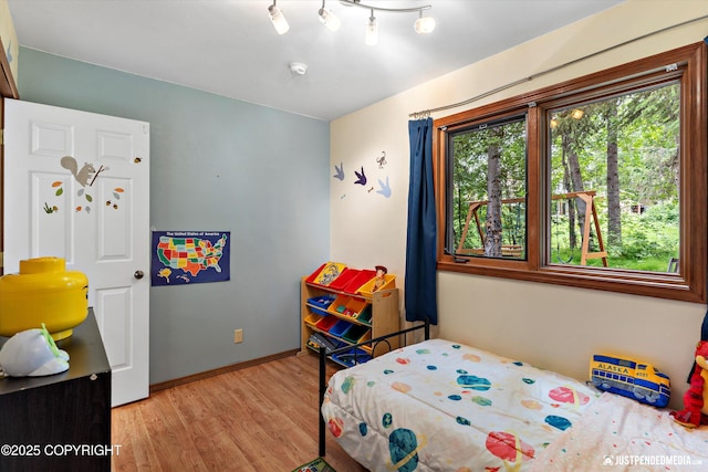 19111 Sarichef Loop, Eagle River, AK 99577 - bedroom with wood finished floors and baseboards