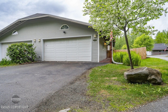 16627 River Heights Loop, Eagle River, AK 99577 - view of front of home with asphalt driveway and a garage