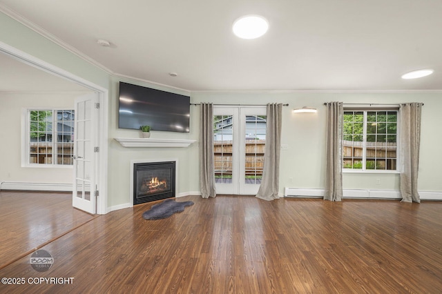 16627 River Heights Loop, Eagle River, AK 99577 - unfurnished living room featuring ornamental molding, wood finished floors, plenty of natural light, a glass covered fireplace, and baseboard heating