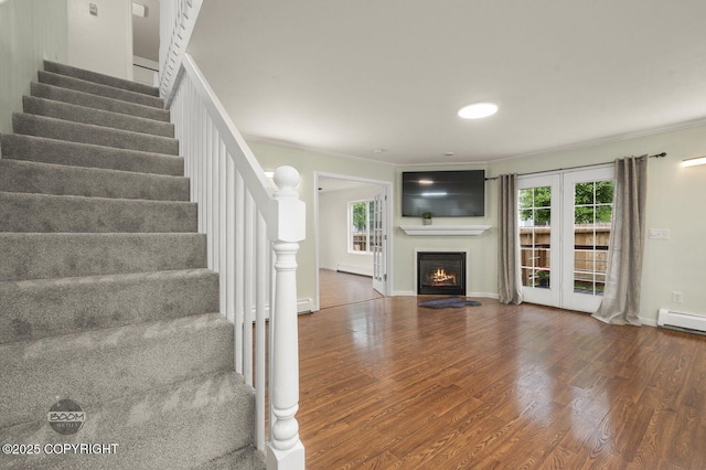 16627 River Heights Loop, Eagle River, AK 99577 - unfurnished living room with ornamental molding, wood finished floors, stairway, and healthy amount of natural light