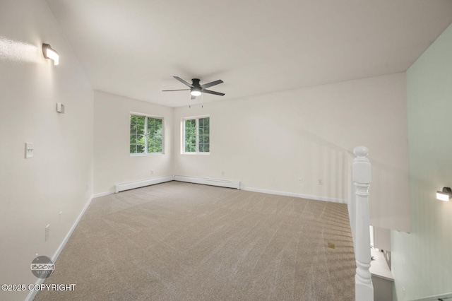 16627 River Heights Loop, Eagle River, AK 99577 - carpeted empty room with a baseboard radiator, a ceiling fan, and baseboards