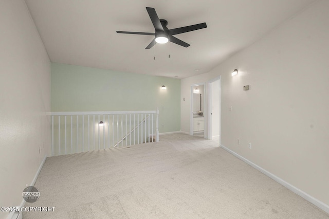 16627 River Heights Loop, Eagle River, AK 99577 - spare room with a ceiling fan, carpet flooring, and baseboards