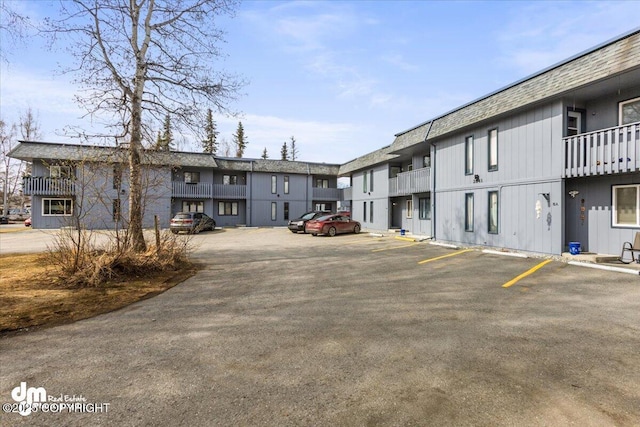 exterior space featuring a residential view and uncovered parking