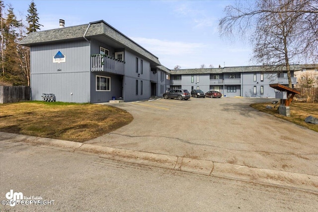 view of street featuring aphalt driveway