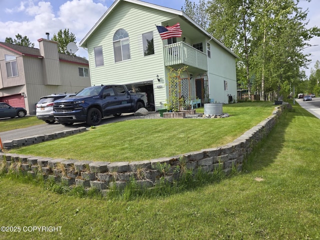 8041 Northwind Ave, Anchorage, AK 99504 - rear view of house featuring a yard, an attached garage, and a balcony