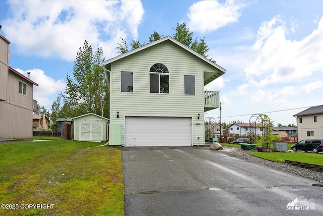 8041 Northwind Ave, Anchorage, AK 99504 - view of front facade with asphalt driveway, a garage, a front yard, a residential view, and a balcony