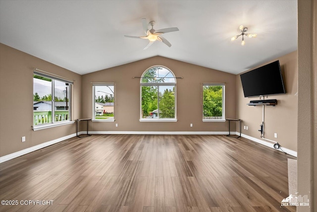 8041 Northwind Ave, Anchorage, AK 99504 - unfurnished living room with ceiling fan, wood finished floors, vaulted ceiling, and baseboards