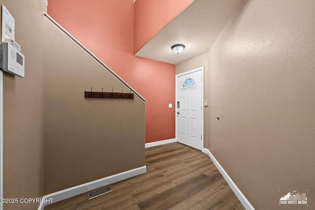 8041 Northwind Ave, Anchorage, AK 99504 - foyer entrance featuring wood finished floors and baseboards