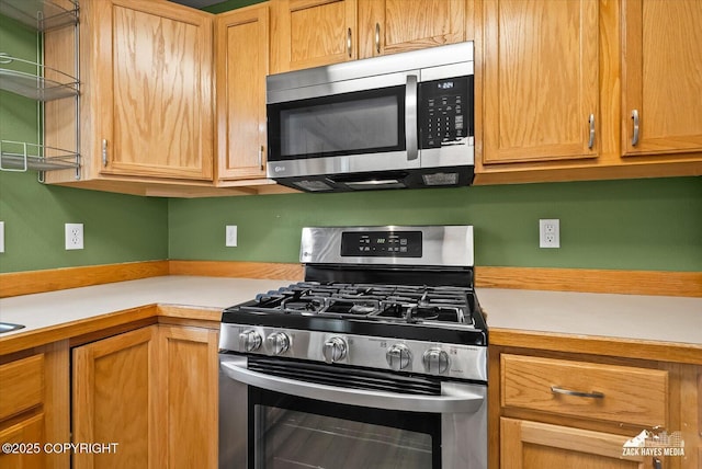 8041 Northwind Ave, Anchorage, AK 99504 - kitchen featuring stainless steel appliances and light countertops
