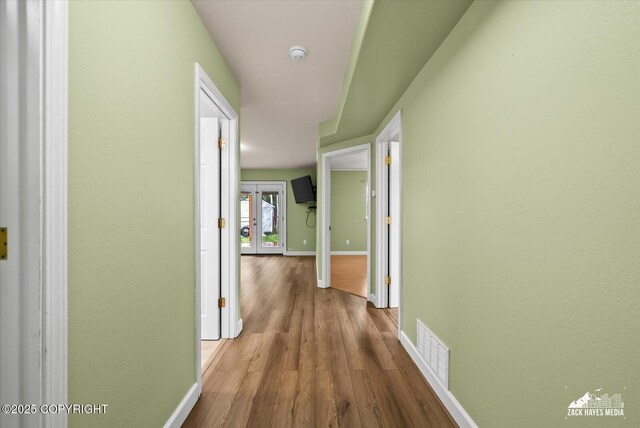 8041 Northwind Ave, Anchorage, AK 99504 - corridor with baseboards and wood finished floors