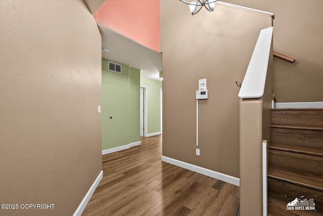 8041 Northwind Ave, Anchorage, AK 99504 - hallway featuring wood finished floors, baseboards, and stairs