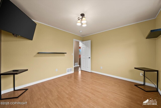 8041 Northwind Ave, Anchorage, AK 99504 - unfurnished room with baseboards, wood finished floors, and ornamental molding