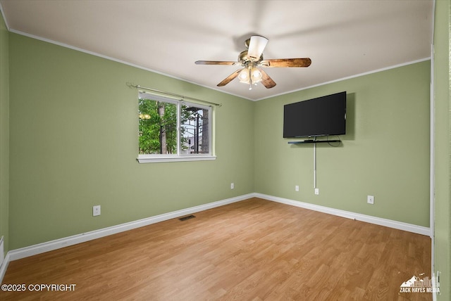 8041 Northwind Ave, Anchorage, AK 99504 - unfurnished room featuring crown molding, wood finished floors, baseboards, and ceiling fan