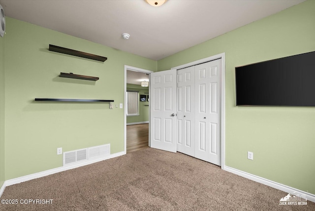 8041 Northwind Ave, Anchorage, AK 99504 - unfurnished bedroom with carpet, baseboards, and a closet
