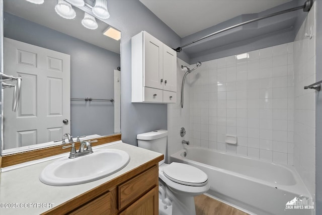 8041 Northwind Ave, Anchorage, AK 99504 - full bathroom featuring vanity,  shower combination, toilet, and wood finished floors