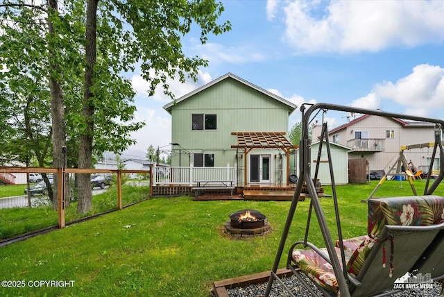 8041 Northwind Ave, Anchorage, AK 99504 - rear view of house with an outdoor fire pit and a deck with water view