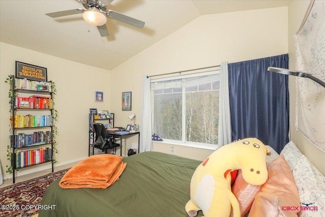 bedroom with vaulted ceiling, ceiling fan, and baseboards