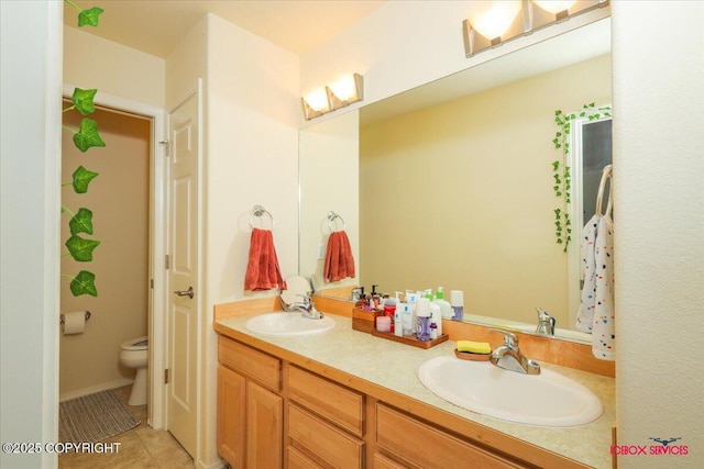 full bathroom with toilet, double vanity, and tile patterned flooring
