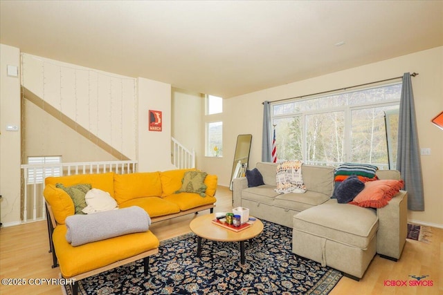 living room featuring wood finished floors and baseboards