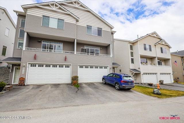 view of property with driveway and an attached garage