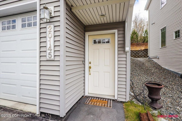 doorway to property featuring a garage