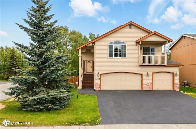 2308 Casey Cusack Loop, Anchorage, AK 99515 - view of front facade with a garage and asphalt driveway