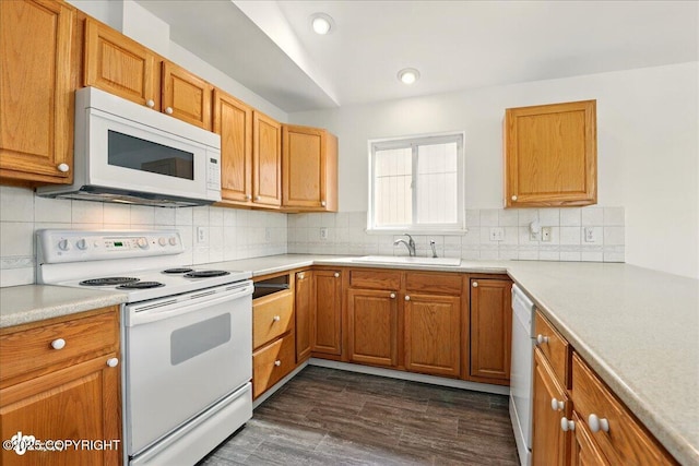 2308 Casey Cusack Loop, Anchorage, AK 99515 - kitchen with white appliances, a sink, dark wood-style floors, decorative backsplash, and recessed lighting