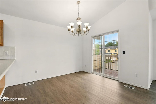 2308 Casey Cusack Loop, Anchorage, AK 99515 - unfurnished dining area with wood finished floors, a chandelier, baseboards, and high vaulted ceiling