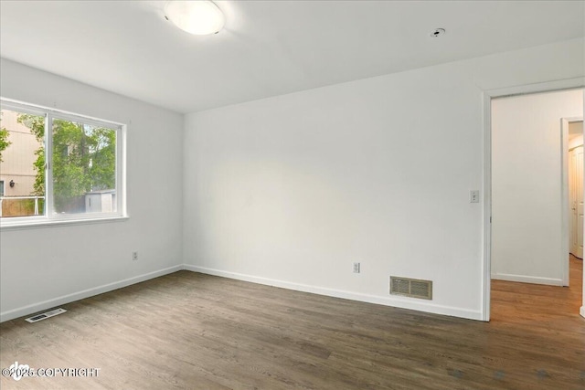 2308 Casey Cusack Loop, Anchorage, AK 99515 - empty room featuring wood finished floors and baseboards