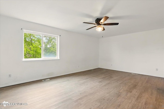 2308 Casey Cusack Loop, Anchorage, AK 99515 - unfurnished room featuring wood finished floors and ceiling fan